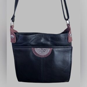 Brighton crossbody black/brown trim. F405969 Bag.  
9X9 inches.  Zipper top.